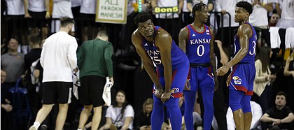 Kansas center Udoka Azubuike looks up at the scoreboard during a timeout in the second half of an NCAA college basketball game against Baylor on Saturday, Feb. 22, 2020, in Waco, Texas. (AP Photo/Ray Carlin)
