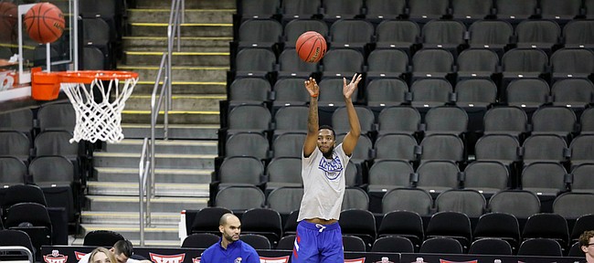 Kansas guard Isaiah Moss (4) puts up a three during practice on Wednesday, March 11, 2020 at Sprint Center.