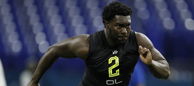 Kansas offensive lineman Hakeem Adeniji runs a drill at the NFL football scouting combine in Indianapolis, Friday, Feb. 28, 2020. (AP Photo/Charlie Neibergall)