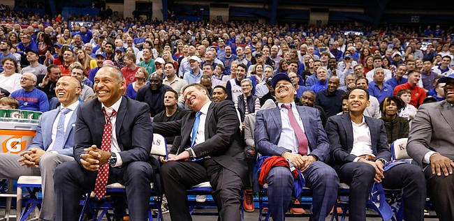 Kansas head coach Bill Self laughs with members of his coaching staff as Kansas center Udoka Azubuike (35) tells a story about him during the senior speeches.