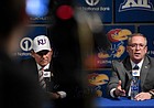 Kansas Athletics Director Jeff Long, right, answers a question at a press conference introducing new football coach Les Miles, left, on Sunday, Nov. 18, 2018, at Hadl Auditorium.