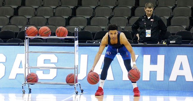 Kansas guard Devon Dotson (1) warms up with some dribbling drills during practice on Wednesday, March 11, 2020 at Sprint Center.