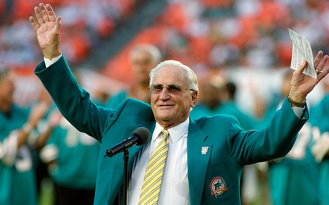 In this Oct. 25, 2009, file photo, former Miami Dolphins head coach Don Shula waves to the crowd during a half time ceremony of an NFL football game between the Miami Dolphins and the New Orleans Saints in Miami. Shula, who won the most games of any NFL coach and led the Miami Dolphins to the only perfect season in league history in 1972, died Monday, May 4, 2020, at his South Florida home, the team said. He was 90.
