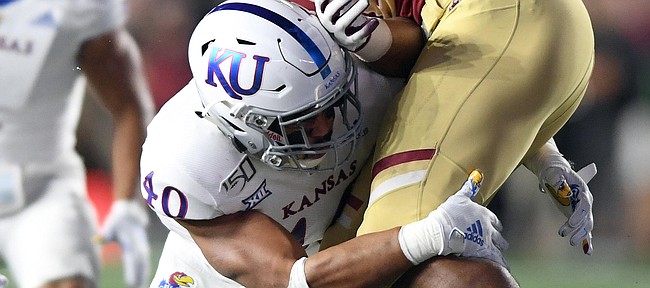 (Boston, MA, 09/13/19) Kansas Jayhawks linebacker Dru Prox (40) stops Boston College Eagles running back AJ Dillon (2) during the first half of an NCAA football game at Boston College in Boston, Mass., on Friday, September 13, 2019.