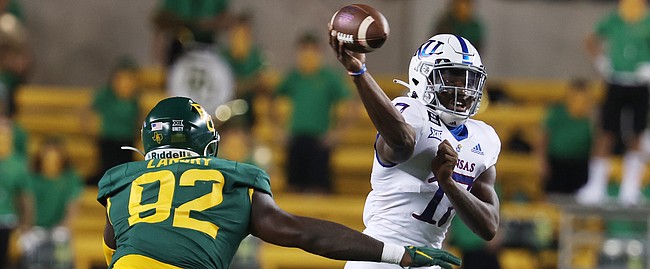 Kansas quarterback Jalon Daniels throws a pass against Baylor in the first half of an NCAA college football game, Saturday, Sept. 25, 2020, in Waco, Texas. (Rod Aydelotte/Waco Tribune Herald, via AP)