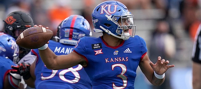 Kansas quarterback Miles Kendrick passes to a teammate during the first half of an NCAA college football game against Oklahoma State in Lawrence, Kan., Saturday, Oct. 3, 2020.


