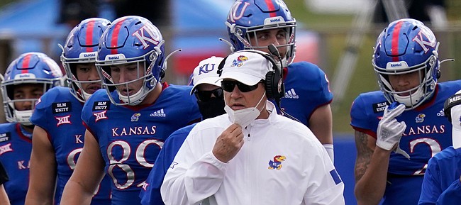 KU coach Les Miles joins his team on the field during KU's 47-7 loss to Oklahoma State on Saturday, Oct. 3, 2020 at David Booth Kansas Memorial Stadium. 