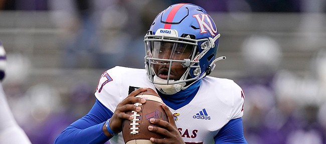 Kansas quarterback Jalon Daniels (17) looks to pass during the first half of an NCAA football game against Kansas State Saturday, Oct. 24, 2020, in Manhattan, Kan. (AP Photo/Charlie Riedel)