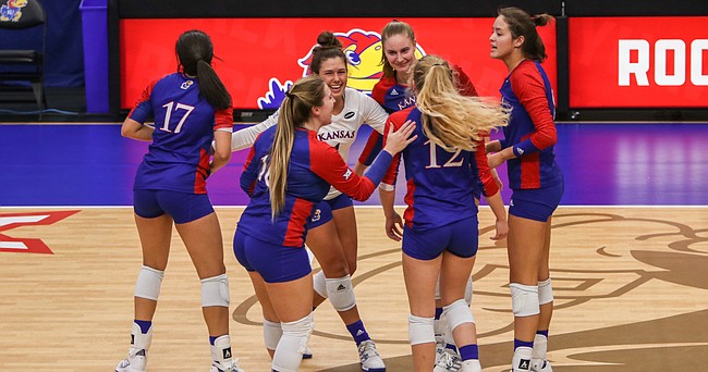 The Jayhawks celebrate a point during their four-set, season-ending victory over Texas Tech on Friday, Nov. 20, 2020 at Horejsi Family Volleyball Arena. 
