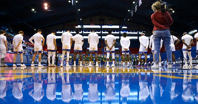 The Jayhawks line up before tipoff against North Dakota State in their second game at Allen Fieldhouse without fans, Saturday, Dec. 5, 2020 at Allen Fieldhouse.