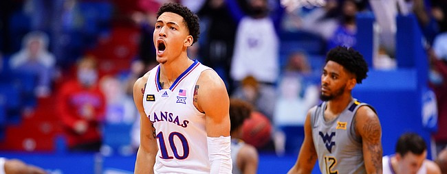 Kansas forward Jalen Wilson (10) roars after hitting a three pointer against West Virginia during the second half, Tuesday, Dec. 22, 2020 at Allen Fieldhouse.