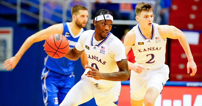 Kansas guard Marcus Garrett (0) heads up the court after a steal during the second half on Tuesday, Dec. 8, 2020 at Allen Fieldhouse.