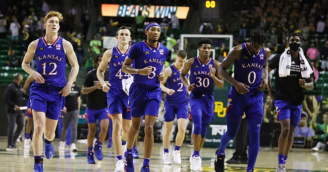 Kansas players leave the court following their loss to Baylor at the Ferrell Center after an NCAA college basketball game, Monday, Jan. 18, 2021, in Waco, Texas. (Rod Aydelotte/Waco Tribune Herald via AP) )