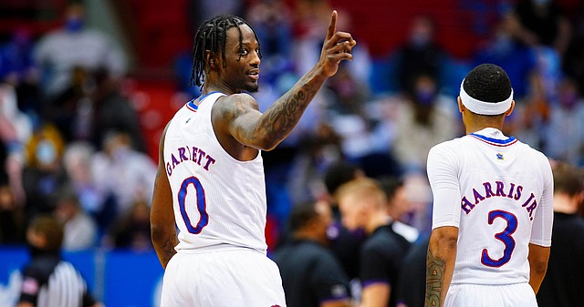 Kansas guard Marcus Garrett (0) signals back to his teammates during the second half on Tuesday, Feb. 2, 2021 at Allen Fieldhouse.