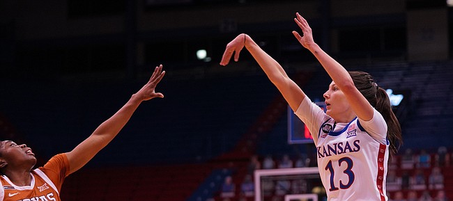 Kansas guard Holly Kersgieter shoots over the extended arm of Texas defender Joanne Allen-Taylor on Feb. 24, 2021, at Allen Fieldhouse.