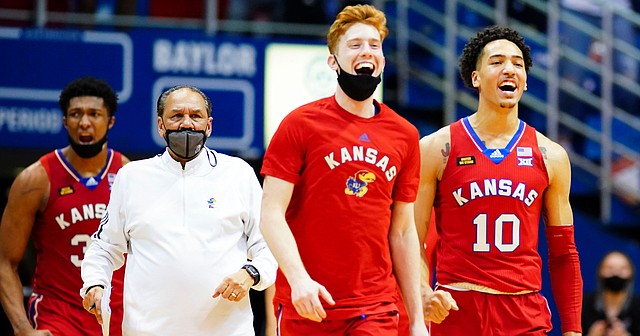 The Kansas bench empties to celebrate during a timeout in the second half on Saturday, Feb. 27, 2021 at Allen Fieldhouse.