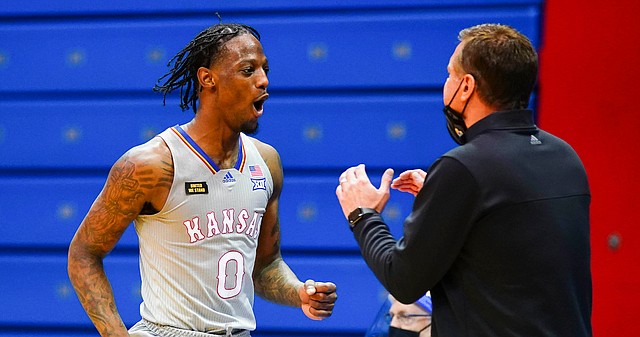 Kansas guard Marcus Garrett (0) and Kansas head coach Bill Self react after being called for a foul during the second half on Thursday, March 4, 2021 at Allen Fieldhouse.