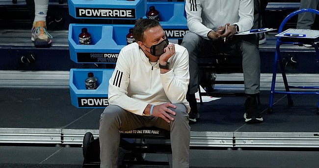 Kansas head coach Bill Self watches from the bench against USC during the second half of a men's college basketball game in the second round of the NCAA tournament at Hinkle Fieldhouse in Indianapolis, Monday, March 22, 2021. (AP Photo/Paul Sancya)