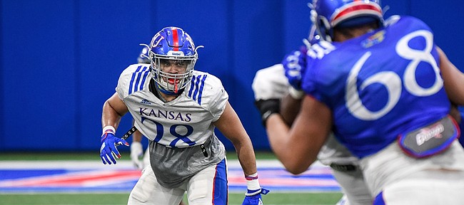 Kansas inside linebacker Taiwan Berryhill surveys the field in front of him during a spring practice at the Jayhawks' indoor facility.