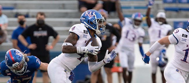 Redshirt freshman safety Johnquai Lewis intercepts the ball in the Kansas Football Spring Game. The White team defeated the Blue 74-42 Saturday, May 1, 2021.