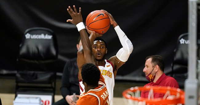 Iowa State guard Jalen Coleman-Lands shoots a 3-point basket over Texas guard Courtney Ramey (3) during the second half of an NCAA college basketball game, Tuesday, March 2, 2021, in Ames, Iowa. Texas won 81-67. 
