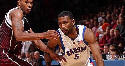 Kansas University senior Keith Langford, right, drives against
Texas A&amp;M's Dominique Kirk. Langford scored nine points in the
Jayhawks' 65-60 victory over the Aggies on Wednesday in Allen
Fieldhouse.
