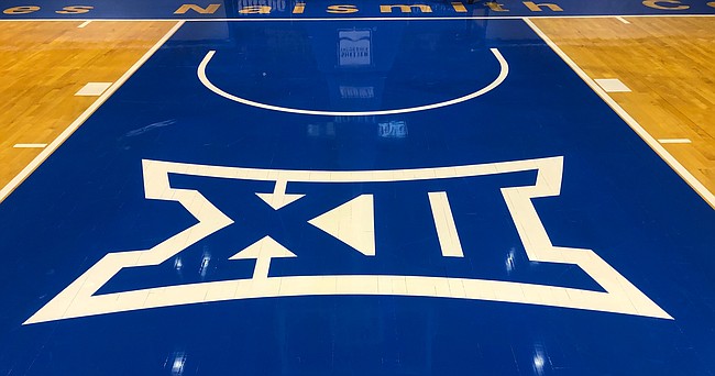 The Big 12 Conference logo is shown here in the lane of the north goal at Allen Fieldhouse. 