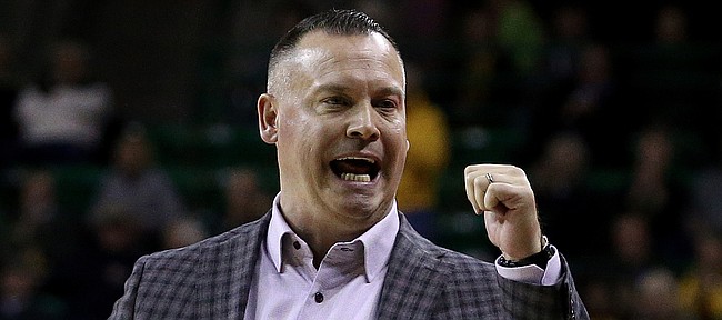 Kansas head coach Brandon Schneider call to his bench in the second half of an NCAA college basketball game against Baylor Wednesday, Feb. 5, 2020, in Waco, Texas. (AP Photo/Jerry Larson)
