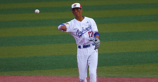 KU freshman Maui Ahuna fires to first base during a KU game in the 2021 season. Ahuna recently earned honorable mention all-Big 12 honors and was named to the Big 12's all-tournament team. 