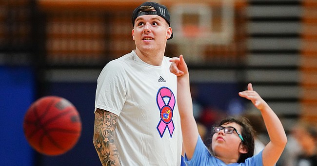 Kansas newcomer Cam Martin watches a shot go up as he works with campers at Washburn head coach Brett Ballard's basketball camp on Wednesday, June 9, 2021 at Lee Arena in Topeka.