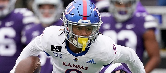 Kansas wide receiver Kwamie Lassiter II runs the ball during the first half of an NCAA football game against Kansas State Saturday, Oct. 24, 2020, in Manhattan, Kan. (AP Photo/Charlie Riedel)