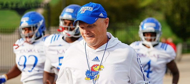 Kansas defensive coordinator Brian Borland takes the field with his players for practice on Saturday, Aug. 14, 2021 at Memorial Stadium.
