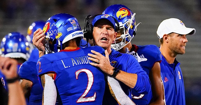 Kansas head coach Lance Leipold hugs Kansas wide receiver Lawrence Arnold (2) after Arnold's touchdown catch during the second quarter on Friday, Sept. 3, 2021 at Memorial Stadium. (Photo by Nick Krug/Special to the Journal-World)