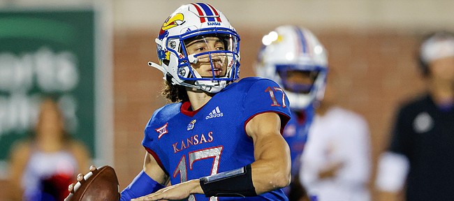 Kansas quarterback Jason Bean looks for a receiver during the first half of the team's NCAA college football game against Coastal Carolina in Conway, S.C., Friday, Sept. 10, 2021. (AP Photo/Nell Redmond)