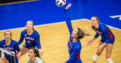 Kansas freshman Caroline Bien (14) swings at a ball during the Jayhawks sweep of Kent State on Saturday, Sept. 11, 2021 at Horejsi Family Volleyball Arena. 