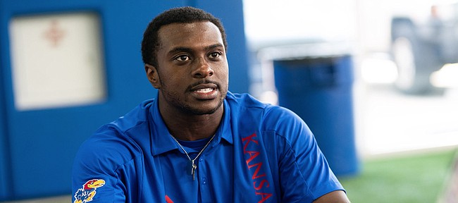 Kansas defensive end Kyron Johnson talks with media members during interview on Tuesday, Aug. 17, 2021 at the Indoor Practice Facility.