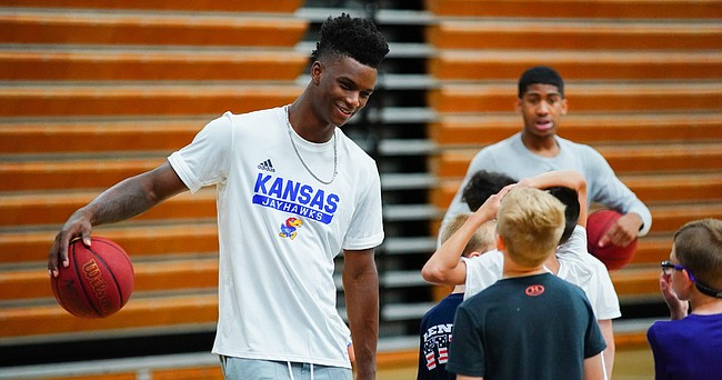 Kansas newcomer KJ Adams jokes with campers at Washburn head coach Brett Ballard's basketball camp on Wednesday, June 9, 2021 at Lee Arena in Topeka.