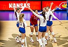 The Kansas Jayhawks celebrate a point late in their match victory over the Kansas City Roos on Thursday, Sept. 16, 2021, at Horejsi Family Volleyball Arena.