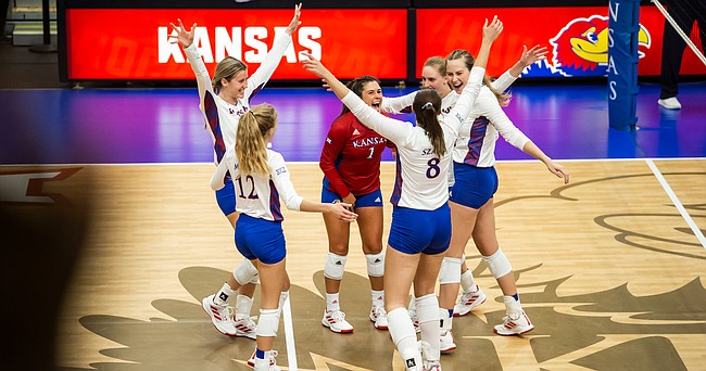 The Kansas Jayhawks celebrate a point late in their match victory over the Kansas City Roos on Thursday, Sept. 16, 2021, at Horejsi Family Volleyball Arena.