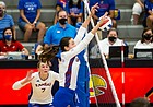 Middle blocker Caroline Crawford eats up a Kansas City Roos attack during the Jayhawks' four-set win on Thursday, Sept. 16, 2021 at Horejsi Family Volleyball Arena. 