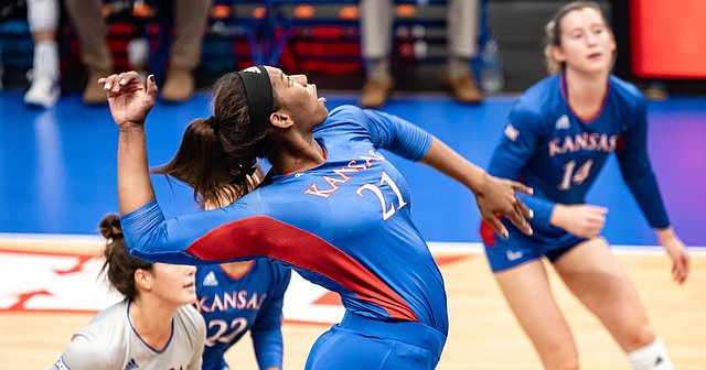 Kansas freshman London Davis swings at a ball during the Jayhawks' sweep of Albany in the final match of the Jayhawk Classic on Saturday, Sept. 18, 2021. 
