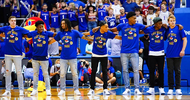 Members of the men's basketball team come together to sing the Alma Mater during Late Night in the Phog, Friday, Oct. 1, 2021 at Allen Fieldhouse.