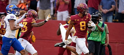 Iowa State wide receiver Xavier Hutchinson (8) scores on a 36-yard touchdown reception ahead of Kansas safety Jayson Gilliom (10) during the first half of an NCAA college football game, Saturday, Oct. 2, 2021, in Ames, Iowa. (AP Photo/Charlie Neibergall)