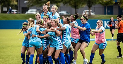 The Kansas women's soccer team celebrates its 2-1, double-overtime victory over No. 9 West Virginia on Sunday, Oct. 10, 2021, at Rock Chalk Park. 