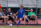 Raena Childers takes a corner kick for Kansas soccer.