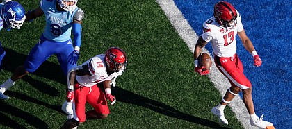 Texas Tech wide receiver Erik Ezukanma (13) runs into the end zone for a touchdown against Kansas during the second quarter of an NCAA college football game Saturday, Oct. 16, 2021, in Lawrence, Kan. (AP Photo/Ed Zurga)