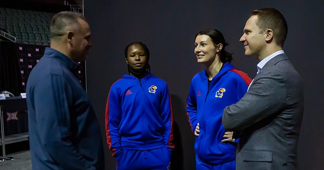 Kansas women's basketball coach Brandon Schneider, along with Jayhawks Zakiyah Franklin, left, and Holly Kersgieter, visit with KU Athletic Director Travis Goff, right, at Big 12 Media Day on Tuesday, Oct. 19, 2021 in Kansas City, Mo. 