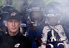 Kansas head coach Lance Leipold waits to lead his team onto the field before an NCAA college football game against Oklahoma Saturday, Oct. 23, 2021, in Lawrence, Kan. (AP Photo/Charlie Riedel)