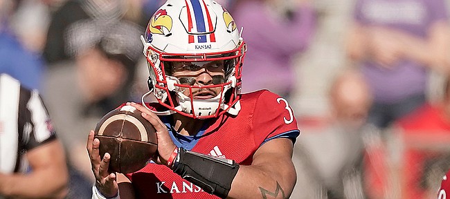 Kansas quarterback Miles Kendrick looks to pass during the first half of a game against Kansas State on Nov. 6, 2021, in Lawrence, Kan.
