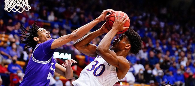 Kansas guard Ochai Agbaji (30) pulls back for a bucket and a foul from Tarleton State guard Tahj Small (4) during the first half on Friday, Nov. 12, 2021 at Allen Fieldhouse.